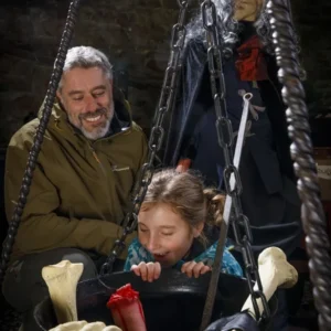 child-and-parent-looking-in-witches-cauldren