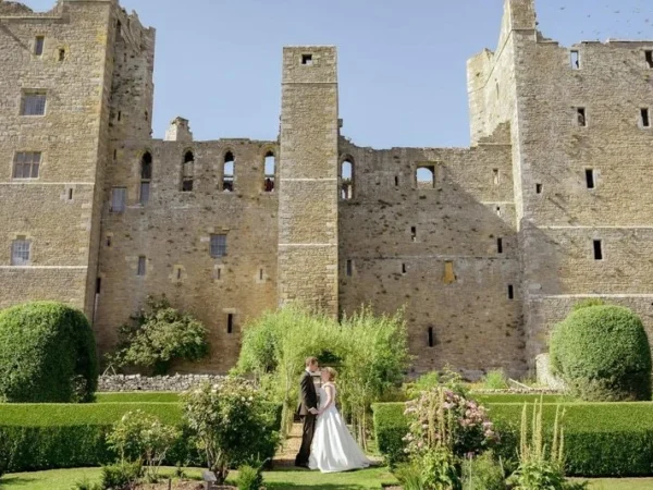 just-married-couple-in-front-of-bolton-castle